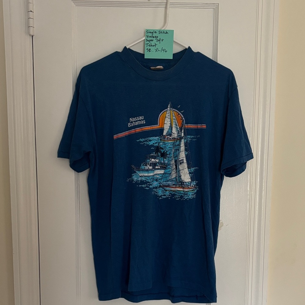 Blue Graphic T-Shirt with Sailboat Design
Single stitch
Bahamas